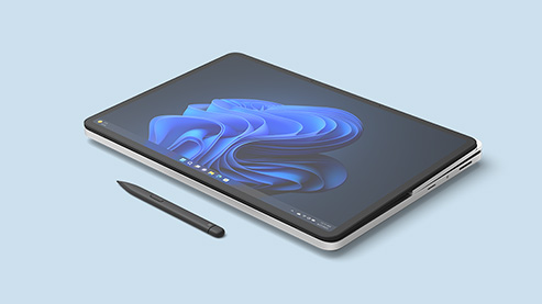 一台处于创意画布下的 Surface Laptop Studio 2 商用版，旁边放置着 Surface 触控笔 2 商用版。