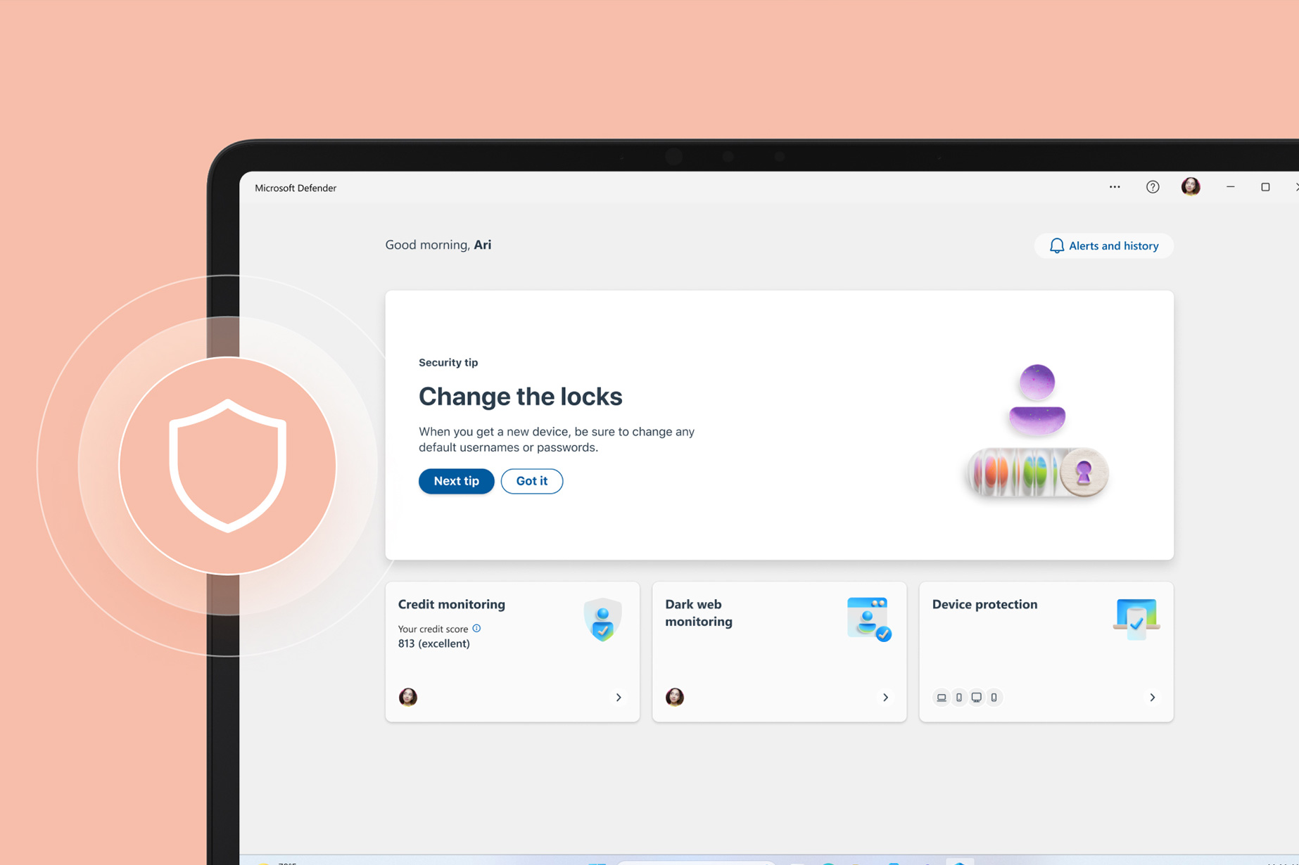 Surface Laptop Go 3 的局部视图，屏幕上显示有 Microsoft Defender，设备上方悬浮着盾牌图标。