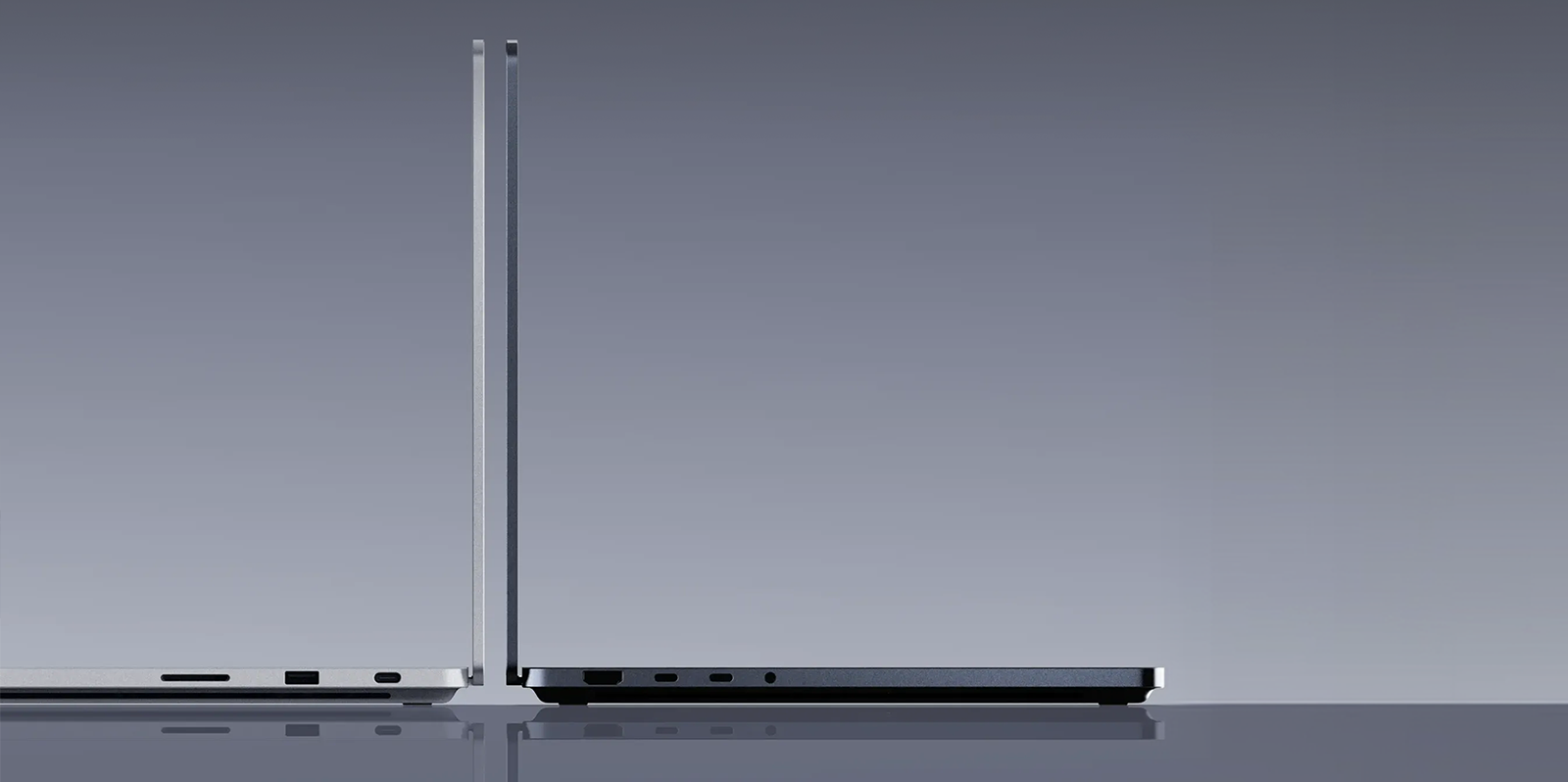 两台背靠背的 Surface Laptop Ultra 商用版，一台为夜幕色，另一台为亮铂金。