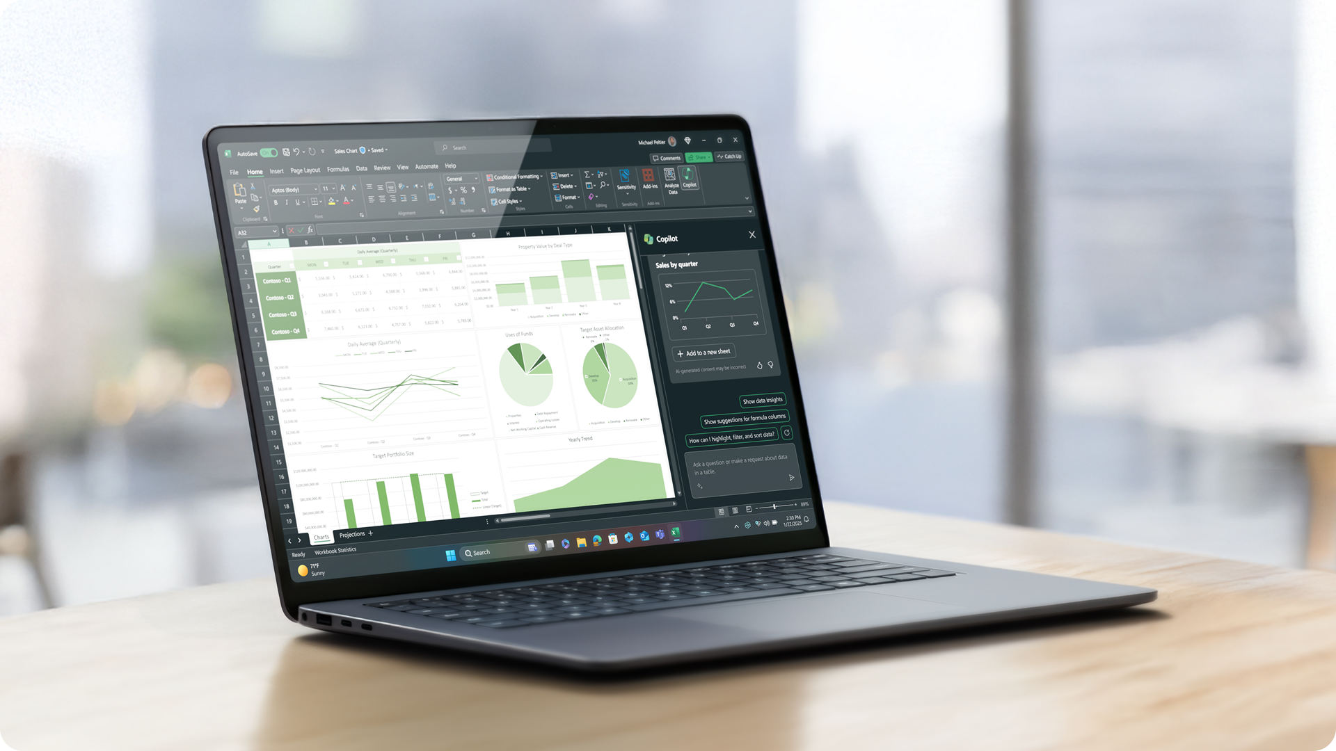 一台打开的 Surface Laptop 商用版放置于桌面，屏幕显示 Excel 应用，
